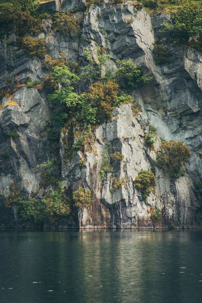 Cliff Face Lake Reflection